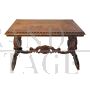 Antique carved desk table with studded leather top