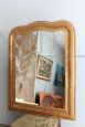 Large antique gilded mirror with a wavy shape