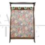 Vintage hallway coat rack covered in floral fabric 