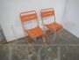 Pair of orange metal garden chairs, 1970s    