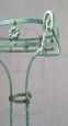 Pair of vertical Art Nouveau plant stands in green lacquered iron