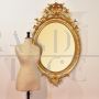 ANTIQUE OVAL MIRROR WITH GOLDEN FRAME, 19th CENTURY.