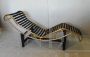 Bauhaus-inspired golden chaise longue in cowhide