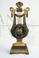 Antique French Empire lyre clock in gilded and patinated bronze