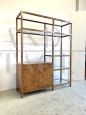 70s bookcase in briarwood and brass with glass shelves