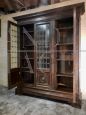 Large 1950s walnut bookcase with leaded glasses