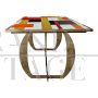 Golden design table with colored Murano glass top