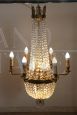 Antique chandelier from the late 19th century in gilded bronze with crystal drops