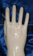 Glazed ceramic hand with crystal base