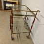 Cesare Lacca serving trolley in brass, glass and burgundy lacquered wood