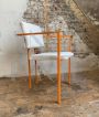 Pair of orange postmodern armchairs with white bouclé wool fabric