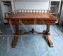 Antique desk in light mahogany with railing on the top