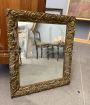 Antique gilded mirror with floral carvings, 19th century