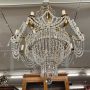 Early 1900s 8-light chandelier in gold metal with crystal drops