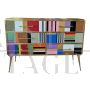 Design dresser with six drawers covered in multicolored glass