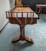 Antique desk in light mahogany with railing on the top