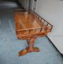 Antique desk in light mahogany with railing on the top