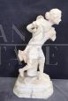 Sculpture of a girl playing tennis in white marble, early decades of the 20th century