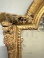 Small antique Louis Philippe mirror carved and gilded, 19th century