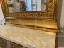 Small antique console table from the Empire period in gilded wood with mirror