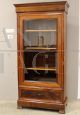 Antique Louis Philippe capuchin walnut display cabinet bookcase from the 19th century