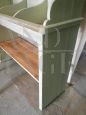 Vintage shop counter and shelving unit in green paint