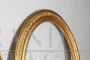 Pair of antique carved and gilded oval frames