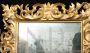 Antique Florentine mirror with large gilded and carved wooden frame