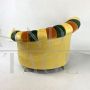 Pair of multicolored round design armchairs with asymmetrical backrest