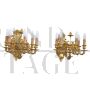 Pair of chiseled gilt bronze wall lights in antique style