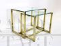 Pair of nesting tables in brass and glass, 1970s