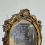 Small French oval mirror from the late 19th century in gilded wood