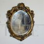 Small French oval mirror from the late 19th century in gilded wood     