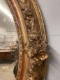 Antique oval mirror from 1840 in gold leaf