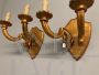 Pair of antique gilded candle-shaped wall lights from 19th century