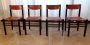 Set of four Ibisco chairs without armrests in brown leather