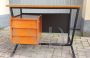 Vintage desk in teak wood and black tufted skai leather