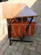 Vintage desk in teak wood and black tufted skai leather