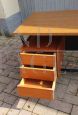 Vintage desk in teak wood and black tufted skai leather