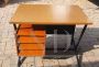 Vintage desk in teak wood and black tufted skai leather