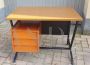 Vintage desk in teak wood and black tufted skai leather