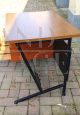 Vintage desk in teak wood and black tufted skai leather