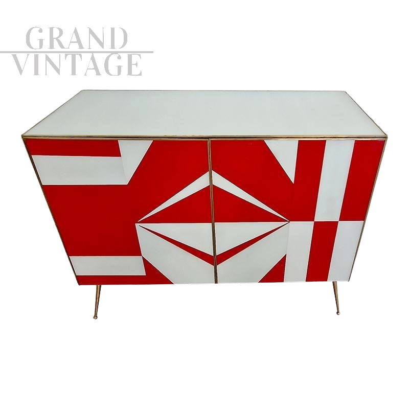 Credenza con geometrie in vetro bianco e rosso                            