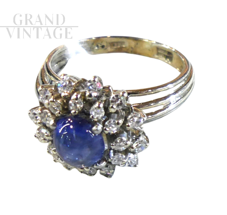 Platinum ring with cabochon sapphire and diamonds 