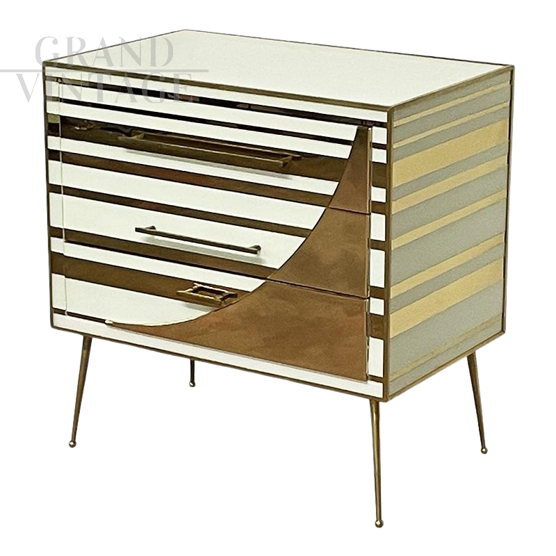 Three-drawer dresser with white and gold glass geometries