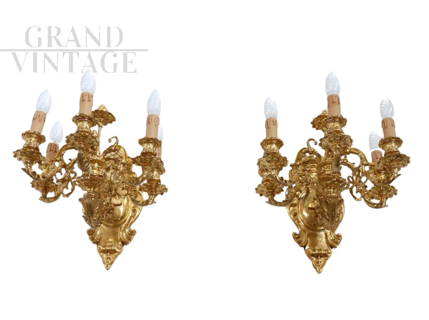 Pair of chiseled gilt bronze wall lights in antique style