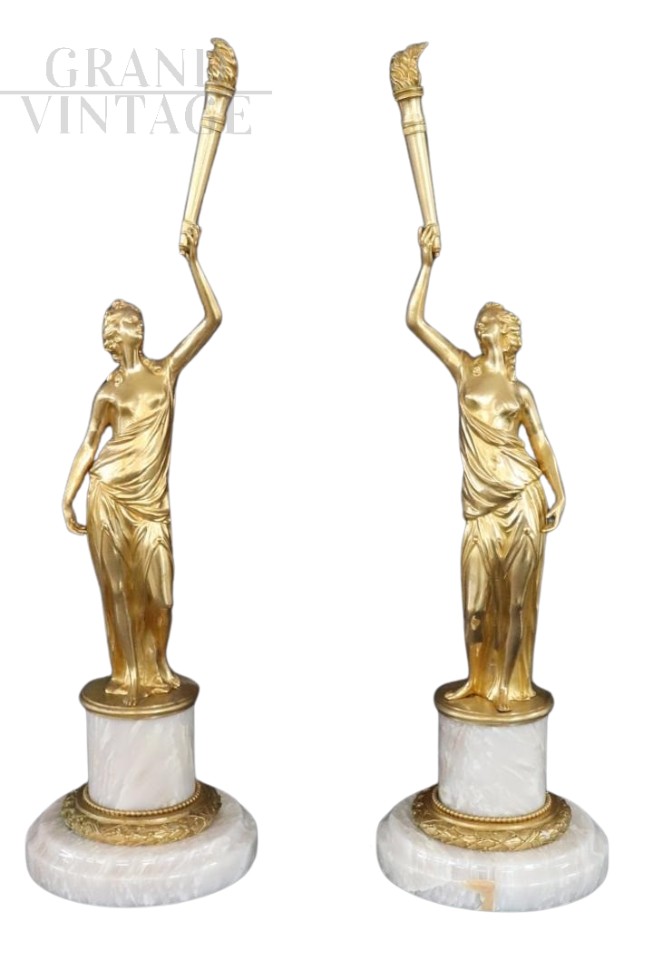 Pair of sculptural female figures in gilded bronze and alabaster