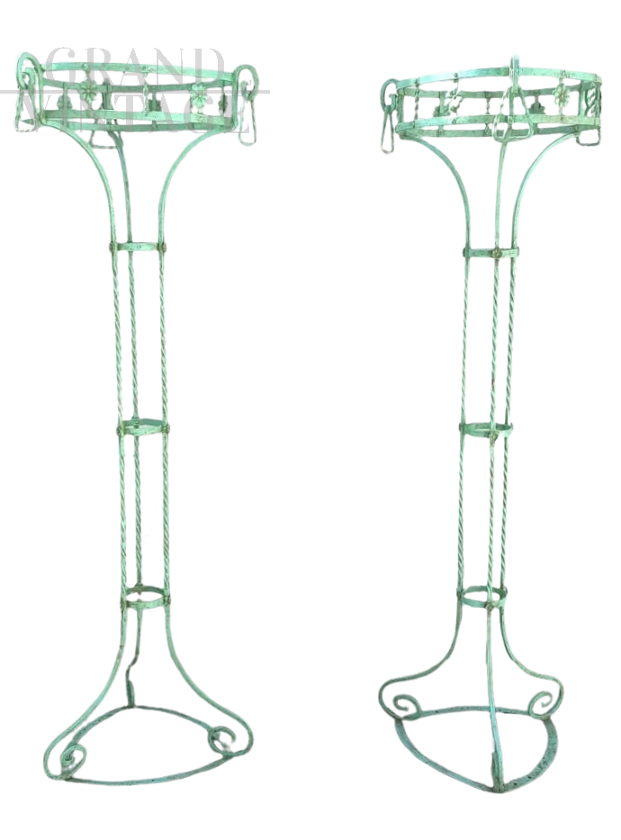 Pair of vertical Art Nouveau plant stands in green lacquered iron     