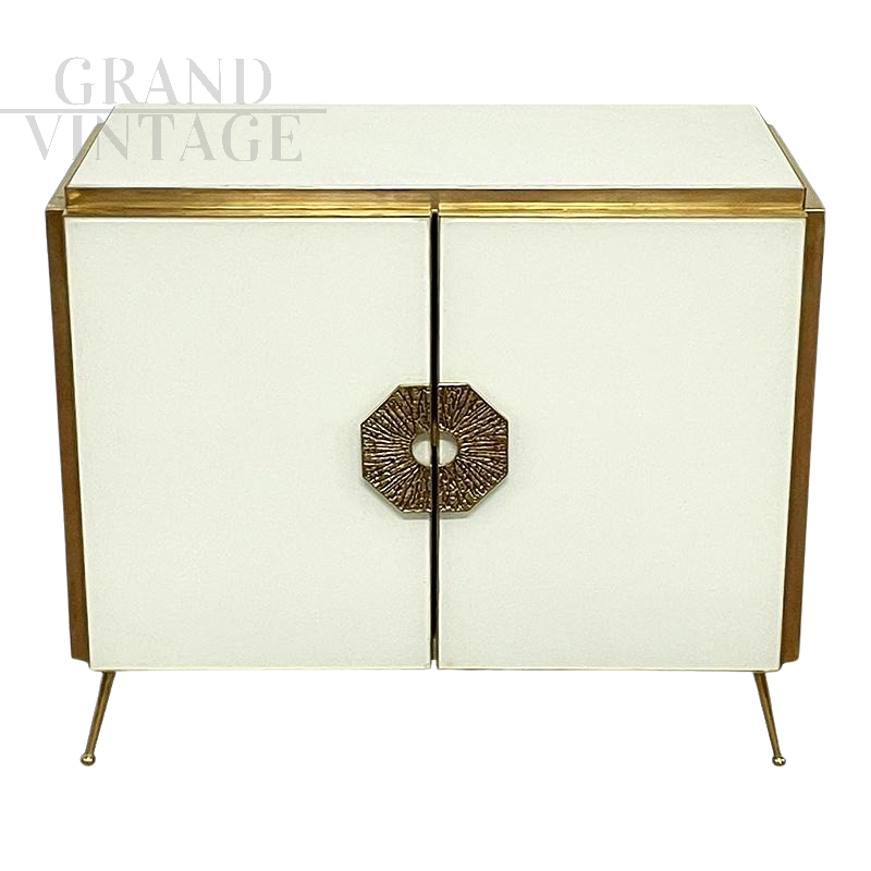 Two-door sideboard in white glass with brass handle