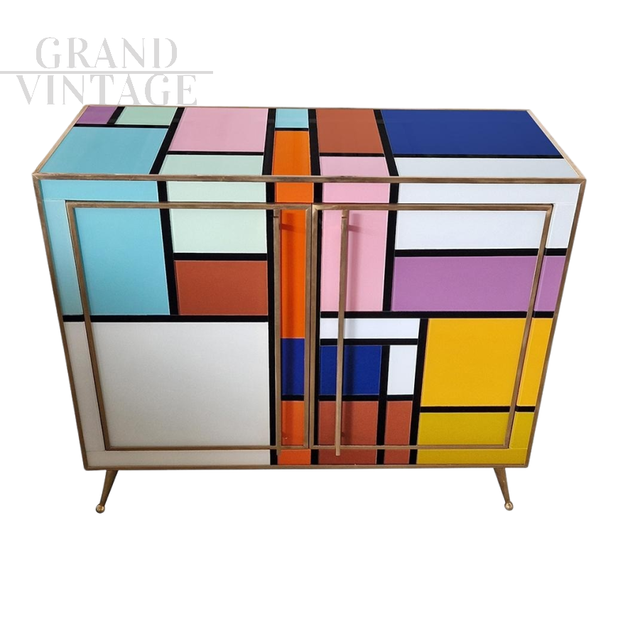 Sideboard in colored glass with illuminated mirror interior